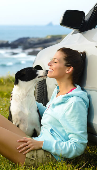 Girl and Dog at Car